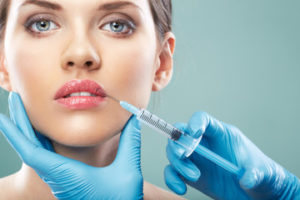 Woman getting a lip injection