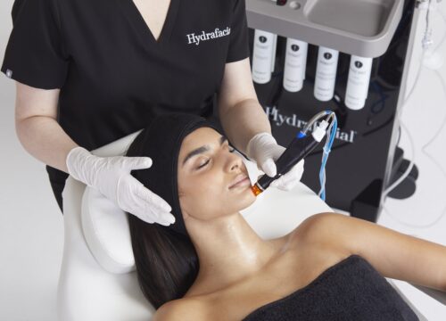 Photo of a woman getting a HydraFacial Syndeo treatment