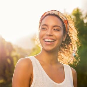 Happy woman outside in the sun