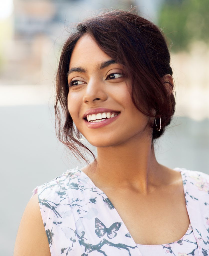 Woman smiling and looking off to the side