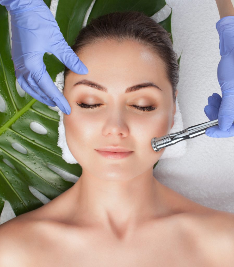 Girl receiving a microdermabrasion treatment