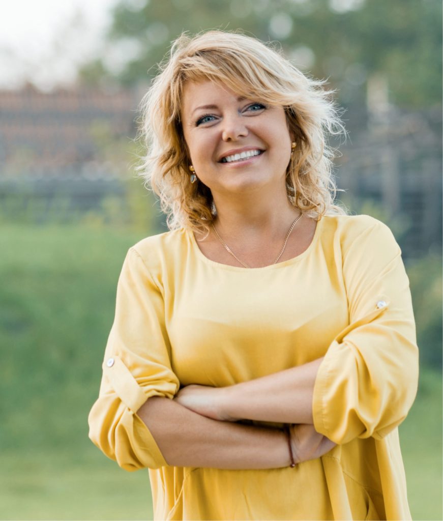 Blonde woman in a yellow blouse