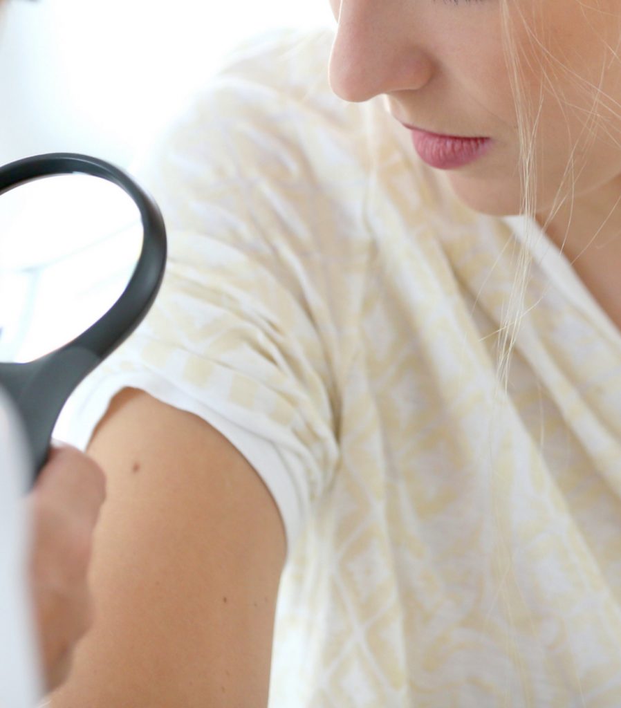 Woman with magnifying glass