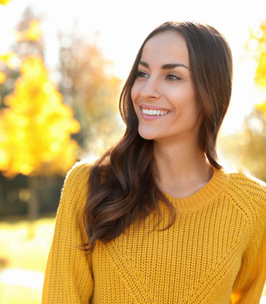 Woman in yellow sweater