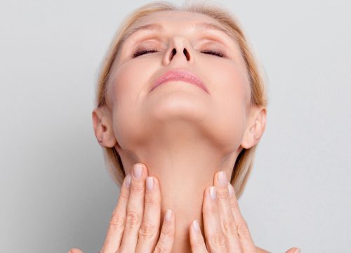 Women with her hand on her neck