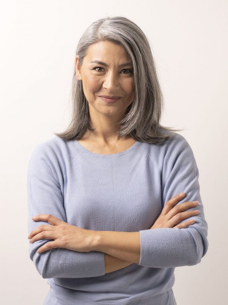 Older woman in a blue sweater