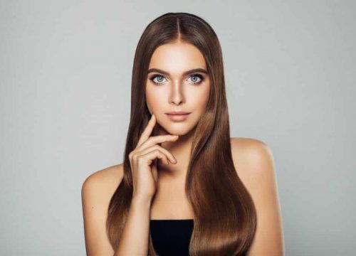 Brunette model wearing a black dress