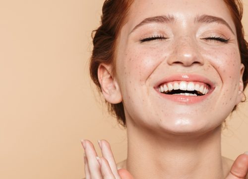 Happy redheaded woman after facials