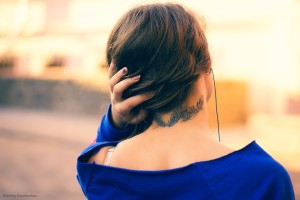 Woman's neck tattoo