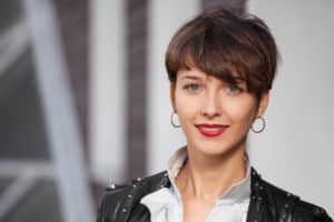 Woman with red lipstick and earrings