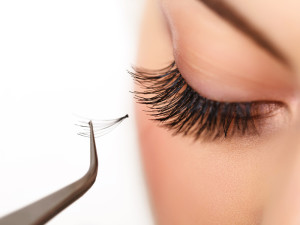 Woman having her lashes removed