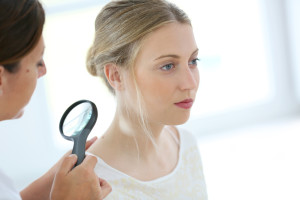 Woman getting a skin cancer check