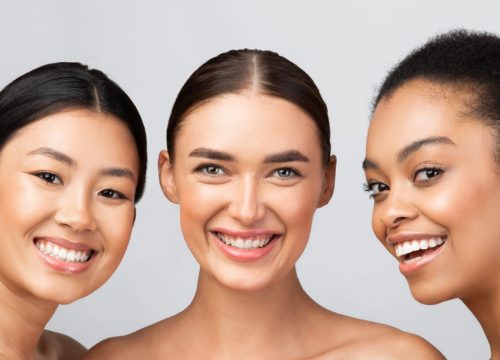 Three smiling women with great skin