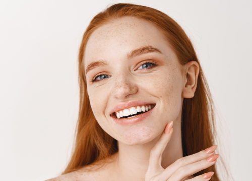 Redheaded woman with great skin