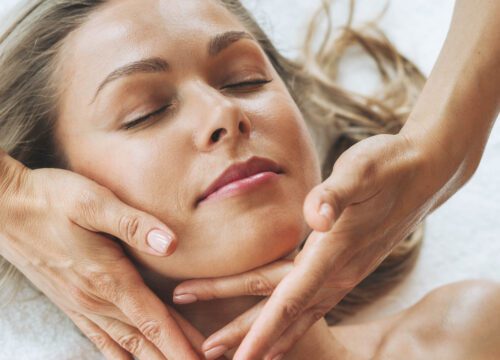 Woman receiving a facial at a spa