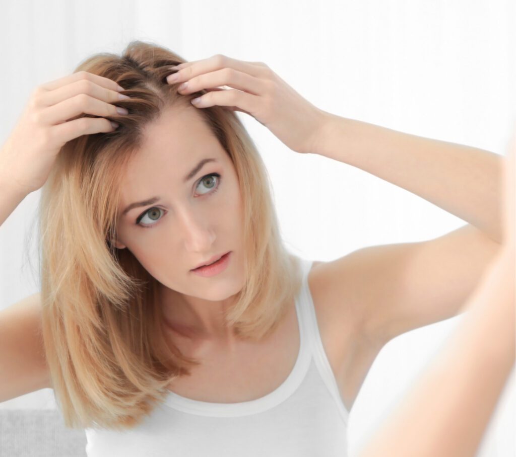 Woman checking her hairline